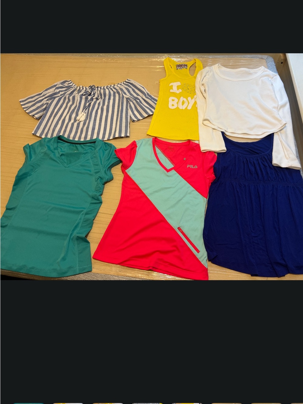 women's casual and activewear tops in various colors and styles, including a red